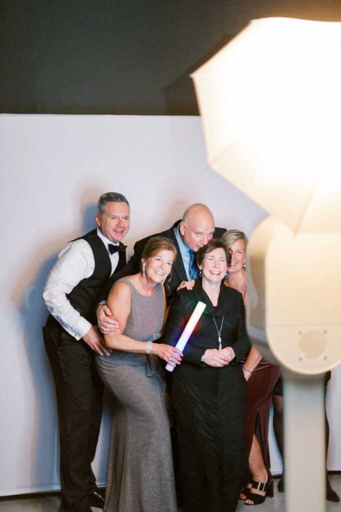 Wedding guests enjoying a photobooth