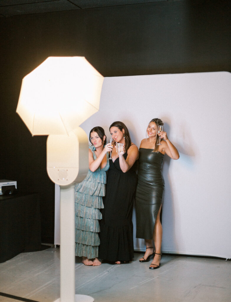 Wedding guests enjoying a photobooth