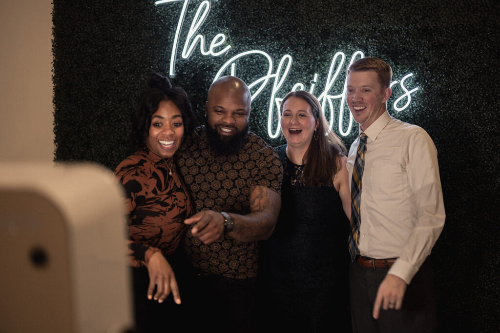 Wedding guests enjoying a photobooth