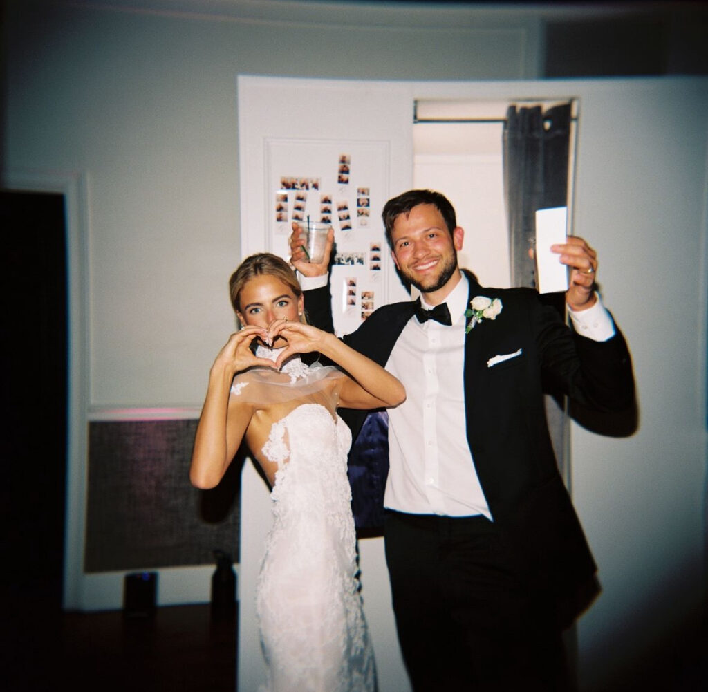 Wedding guests enjoying a photobooth